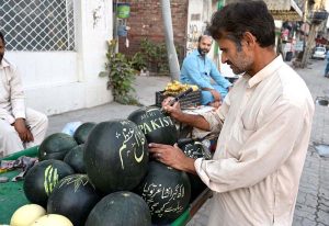 A painter who sells fruit in a unique way, as carves watermelons according to the customer's wishes, that helps to increase the sales