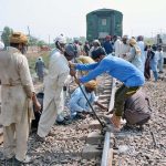 Workers of Pakistan Railways are busy repairing the railway track after the Shalimar Express passenger train collided with a bricks-loaded tractor trolley near RB-142 Choti Ghartal, Sahianwala Interchange near Chak Jhumra
