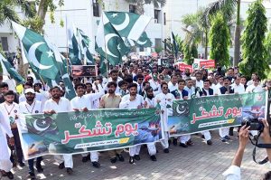 Students participate in a rally in support of the Pakistan Army as the nation observed Youm-i-Tashakar on Friday across the country to honour the armed forces and the people for their victory in Operation Bunyan-um-Marsoos against India at the University of Sargodha