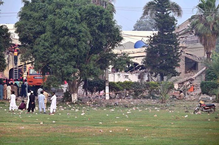 Rescue workers carry out search and rescue operations at the Government Health and Educational Complex in Muridke, about 30 kilometers from Lahore, following Indian airstrikes