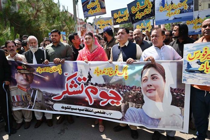 Assistant Commissioner City Anam Babar is leading a rally as the nation observed Youm-i-Tashakar on Friday across the country to honour the armed forces and the people for their victory in Operation Bunyan-um-Marsoos against India organized by the district administration