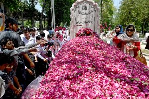 A large number of civil society members laying flowers and offer Duaa at the grave of Dr. Abdul Qadeer Khan observing Youm-E-Takbeer at H-8 graveyard
