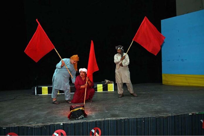 Artists performing in drama titled' Mazdoor Kahani' on the eve of Labour Day organized by Sargodha Arts Council