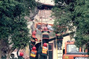 Rescue workers carry out search and rescue operations at the Government Health and Educational Complex in Muridke, about 30 kilometers from Lahore, following Indian airstrikes