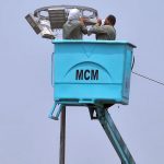 Municipal Corporation workers repair LED streetlights near Eidgah, ensuring safer nighttime travel ahead of Eid festivities