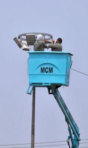 Municipal Corporation workers repair LED streetlights near Eidgah, ensuring safer nighttime travel ahead of Eid festivities