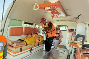 Rescue 1122 personnel perform life-saving drills during a pre flood mock exercise near the Chenab River, practicing CPR, bandaging, and emergency care to ensure swift response during potential disasters.