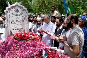 A large number of civil society members laying flowers and offer Duaa at the grave of Dr. Abdul Qadeer Khan observing Youm-E-Takbeer at H-8 graveyard