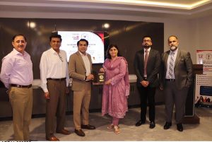 Chairperson NAVTTC Ms Gulmina Bilal Ahmed conferring the accreditation certificate by City & Guilds UK & GEMS to Mr Muhammad Aurangzeb Nadeem, the executive director American Lycetuff DNK School system in federal capital