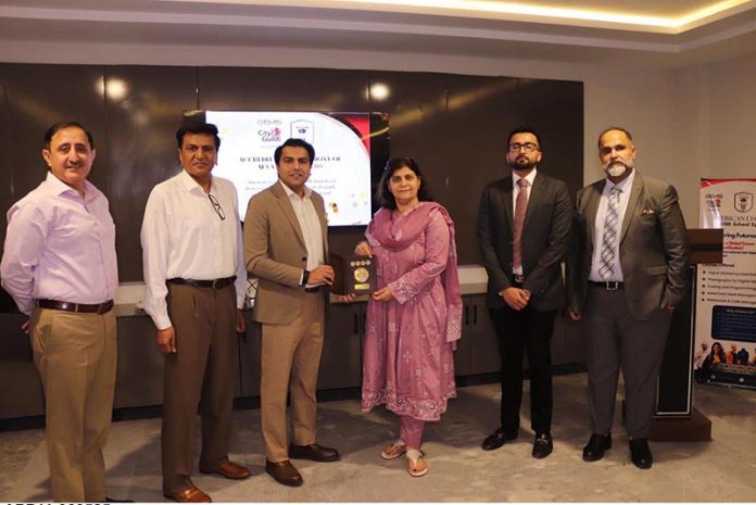 Chairperson NAVTTC Ms Gulmina Bilal Ahmed conferring the accreditation certificate by City & Guilds UK & GEMS to Mr Muhammad Aurangzeb Nadeem, the executive director American Lycetuff DNK School system in federal capital