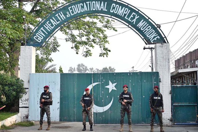 Security officials standing high alert outside the Government Health and Educational Complex, about 30 kilometers from Lahore, following Indian airstrikes