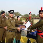 RPO Sargodha Muhammad Shahzad Asif Khan and Dr. Anam Faryal Afzal, Principal of Police Training School Sargodha, giving away an award to a top-performing trainee during the passing out ceremony of the 94th Basic Recruit Course