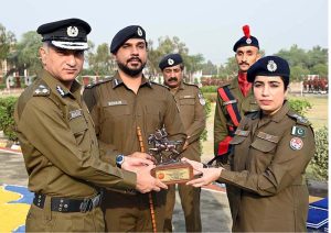 RPO Sargodha Muhammad Shahzad Asif Khan and Dr. Anam Faryal Afzal, Principal of Police Training School Sargodha, giving away an award to a top-performing trainee during the passing out ceremony of the 94th Basic Recruit Course