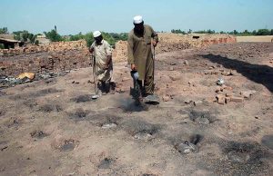 Workers engaged in construction brick-making at a local kiln as part of their daily labor
