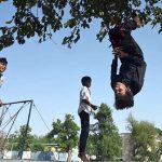 Children enjoy jumping on a trampoline to beat boredom in G7 sector of the federal capital