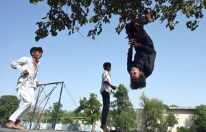 Children enjoy jumping on a trampoline to beat boredom in G7 sector of the federal capital