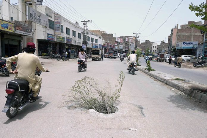 An open manhole in the middle of Risala Road poses a safety hazard and requires immediate attention from the concerned authorities