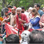 Labour leader Dr. Taimur-ur-Rehman addressing during Workers' Rally on Mall Road on the occasion of International Workers' Day. May 1st, International Workers' Day, commemorates the historic struggles of working people worldwide. In 1884, the Federation of Organized Trades and Labour Unions passed a resolution declaring that eight hours would constitute a legal day's work, effective from May 1, 1886