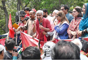 Labour leader Dr. Taimur-ur-Rehman addressing during Workers' Rally on Mall Road on the occasion of International Workers' Day. May 1st, International Workers' Day, commemorates the historic struggles of working people worldwide. In 1884, the Federation of Organized Trades and Labour Unions passed a resolution declaring that eight hours would constitute a legal day's work, effective from May 1, 1886
