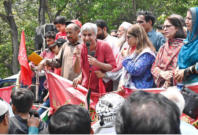 Labour leader Dr. Taimur-ur-Rehman addressing during Workers' Rally on Mall Road on the occasion of International Workers' Day. May 1st, International Workers' Day, commemorates the historic struggles of working people worldwide. In 1884, the Federation of Organized Trades and Labour Unions passed a resolution declaring that eight hours would constitute a legal day's work, effective from May 1, 1886