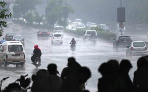 Vehicles on the way at Islamabad Expressway during rain that experienced the Federal Capital