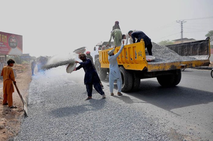 Labourers are busy construction work of head Muhammad wala road