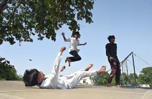 Children enjoy jumping on a trampoline to beat boredom in G7 sector of the federal capital
