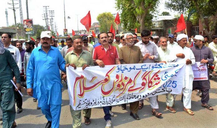 Pakistan Mazdoor Mahaz Punjab President Doctor Ali Amin and Labour Wing President M. M. Atif Advocate leading a Labour Day Rally from TMA Chowk to District Press Club