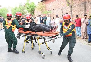 A view of joint mock exercises conducted by Rescue 1122, Civil Defense, Police, and STD to enhance preparedness for emergency situations