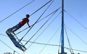 Children enjoy jumping on a trampoline to beat boredom in G7 sector of the federal capital
