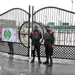 Security personnel stands alert in front of Food Street gate and cordon off area after Pakistan shot down Indian drone