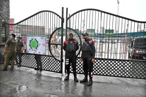 Security personnel stands alert in front of Food Street gate and cordon off area after Pakistan shot down Indian drone