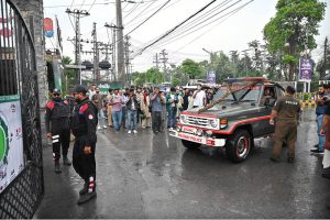 Security personnel stands alert in front of Food Street gate and cordon off area after Pakistan shot down Indian drone