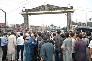 Security personnel stands alert in front of Food Street gate and cordon off area after Pakistan shot down Indian drone