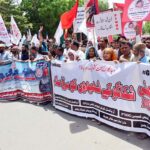 Workers of different organizations are participating in a rally on the eve of World Labour Day. May 1st, International Workers' Day, commemorates the historic struggles of working people worldwide. In 1884, the Federation of Organized Trades and Labour Unions passed a resolution declaring that eight hours would constitute a legal day's work, effective from May 1, 1886