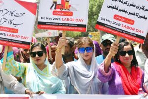 Workers of different organizations are participating in a rally on the eve of World Labour Day. May 1st, International Workers' Day, commemorates the historic struggles of working people worldwide. In 1884, the Federation of Organized Trades and Labour Unions passed a resolution declaring that eight hours would constitute a legal day's work, effective from May 1, 1886