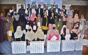 Provincial Minister for Health and Population Khawaja Imran Nazeer is distributing desktop computers during a ceremony at local Hotel