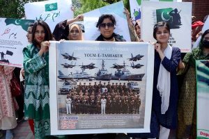 Students of Government College Women University Faisalabad (GCWUF) hold placards and banners to express gratitude to the Pakistan Army for its successful response against Indian aggression