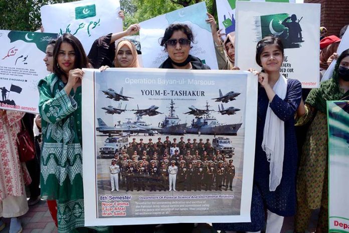 Students of Government College Women University Faisalabad (GCWUF) hold placards and banners to express gratitude to the Pakistan Army for its successful response against Indian aggression