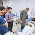 Federal Minister for Interior Mohsin Naqvi inquiring about the health of drone attack victim Tauqeer Abbas