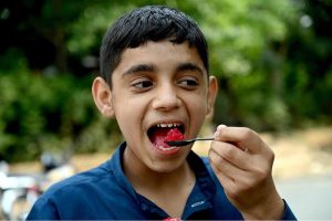 Youngster enjoy eating ice Gola at G-7 in the Federal Capital