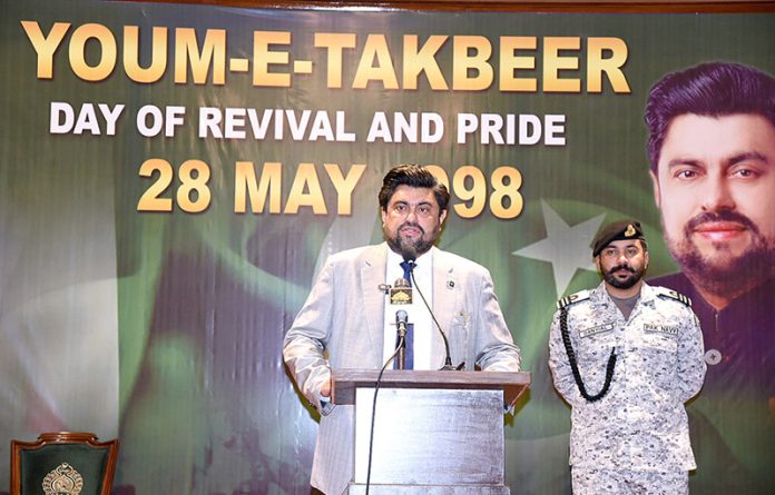 Sindh Governor Kamran Tessori speaks at a ceremony at the Governor House to mark Youm-e-Takbeer