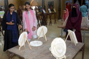 Visitors take keen interest in the three painting exhibitions organized by male and female students of the University of Education, Lower Mall Campus in provincial capital