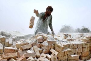 A youngster labourer on the way along with donkeys near a local bricks kiln as the world celebrates International Labour Day. May 1st, International Workers' Day, commemorates the historic struggles of working people worldwide. In 1884, the Federation of Organized Trades and Labour Unions passed a resolution declaring that eight hours would constitute a legal day's work, effective from May 1, 1886