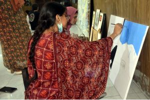 Visitors take keen interest in the three painting exhibitions organized by male and female students of the University of Education, Lower Mall Campus in provincial capital
