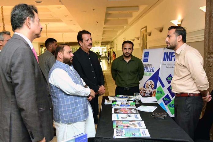 Federal Minister for National Heritage, Culture Division and Chairman QMMB, Mr. Aurangzeb Khan Khichi visiting the stall during a seminar on Women in Agriculture Leadership, Innovation and Impact and Entrepreneurship at local hotel