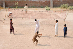 Children enjoy riding bicycle toys at Latifabad