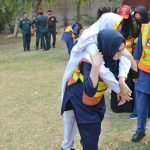 In view of the Indian aggression and current security situation, Civil Defense and Rescue teams conduct a mock emergency drill for female students at Government Comprehensive Girls High School in Madina Town