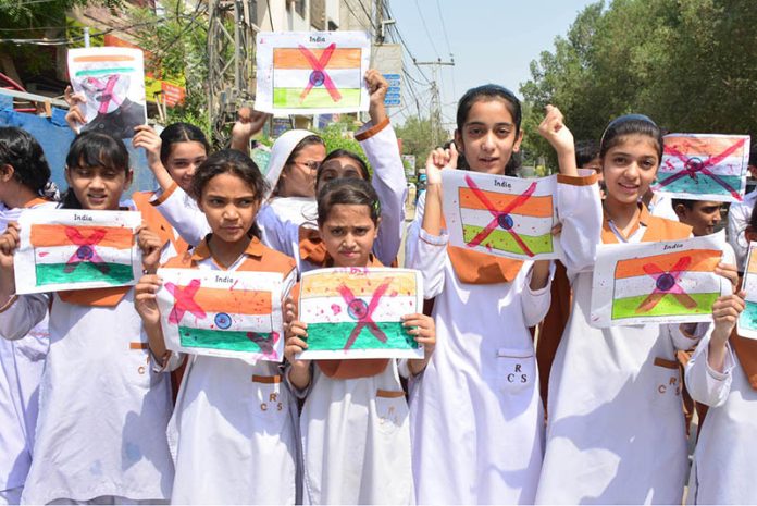 Students of Royal Public School System hold a protest against Indian airstrikes at Latifabad