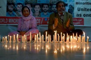 Convener of the World Minorities Alliance, J. Salik, along with his wife, lighting candles to show solidarity as the nation observed Youm-i-Tashakur on Friday across the country to honour the armed forces and the people for their victory in Operation Bunyan-um-Marsoos against India